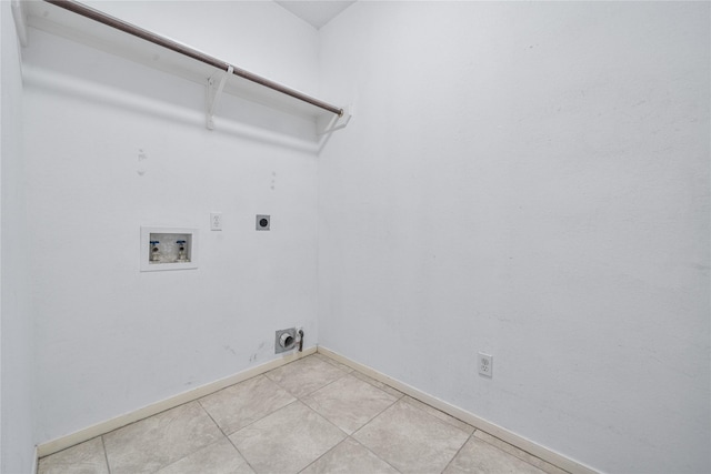 19315 Oak Station Dr, Humble, TX 77346 - laundry room featuring hookup for an electric dryer, hookup for a washing machine, baseboards, and light tile patterned floors