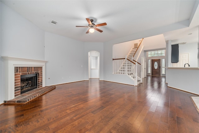 19315 Oak Station Dr, Humble, TX 77346 - unfurnished living room with stairway, ceiling fan, hardwood / wood-style floors, and baseboards