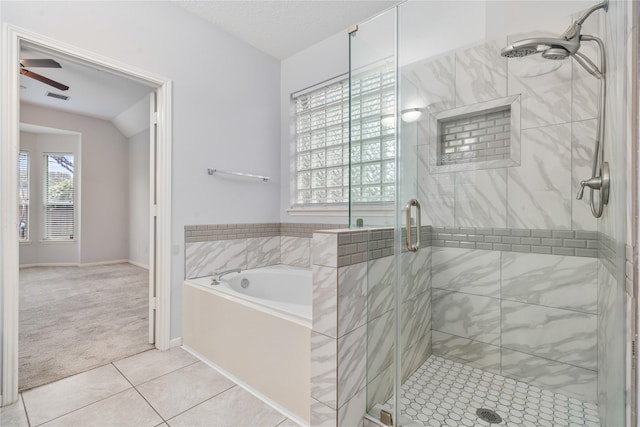 19315 Oak Station Dr, Humble, TX 77346 - bathroom with a garden tub, tile patterned floors, a stall shower, and ceiling fan