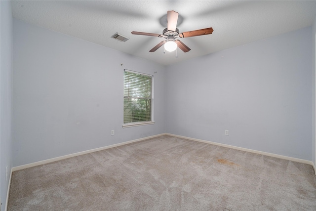 19315 Oak Station Dr, Humble, TX 77346 - empty room with a ceiling fan, carpet floors, and baseboards