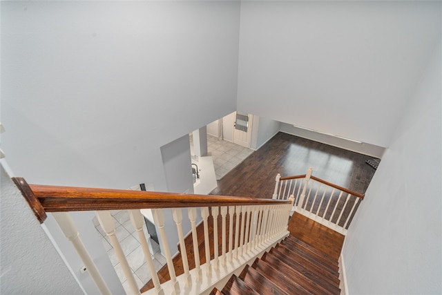 19315 Oak Station Dr, Humble, TX 77346 - stairs with wood finished floors and baseboards