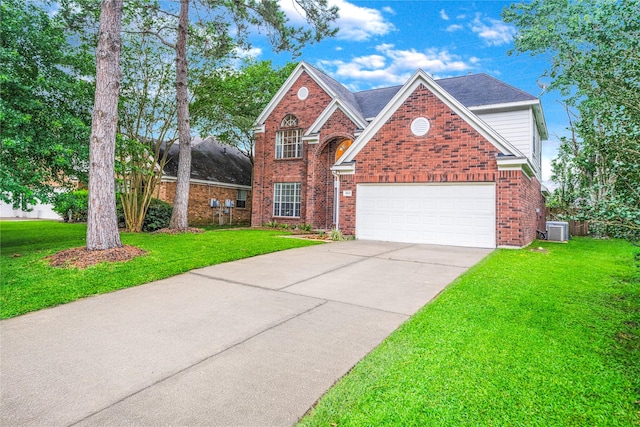 19315 Oak Station Dr, Humble, TX 77346 - traditional-style house featuring central AC, driveway, a front lawn, and brick siding