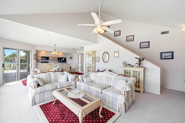 4122 Pirates Aly, Galveston, TX 77554 - living area with light colored carpet, a ceiling fan, and high vaulted ceiling