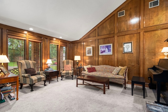 815 Millpond Dr, Sugar Land, TX 77498 - living room with light carpet, lofted ceiling, and wood walls