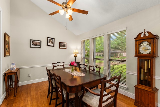 815 Millpond Dr, Sugar Land, TX 77498 - dining room with wood finished floors, lofted ceiling, and a ceiling fan