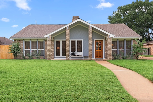 815 Millpond Dr, Sugar Land, TX 77498 - view of front of house featuring a chimney, brick siding, and roof with shingles