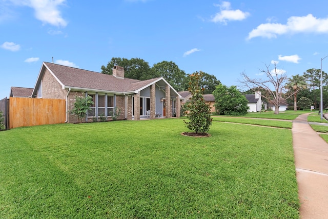 815 Millpond Dr, Sugar Land, TX 77498 - view of front of house featuring brick siding, a chimney, and roof with shingles