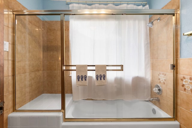 815 Millpond Dr, Sugar Land, TX 77498 - bathroom featuring tiled shower / bath