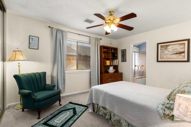 815 Millpond Dr, Sugar Land, TX 77498 - bedroom with carpet flooring, a ceiling fan, and ensuite bath