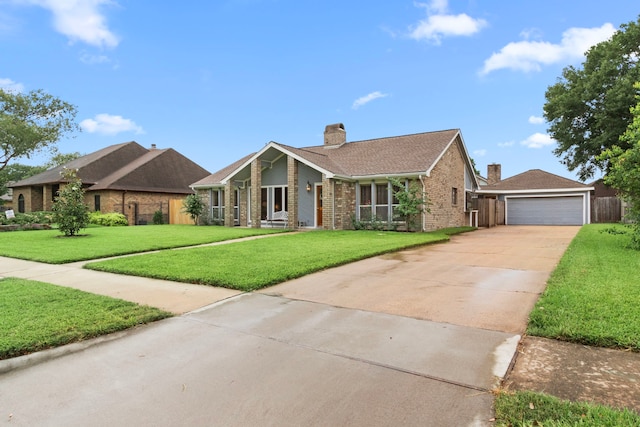 815 Millpond Dr, Sugar Land, TX 77498 - view of front of house featuring brick siding, a front lawn, concrete driveway, and a chimney