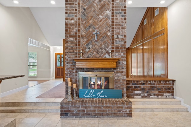 815 Millpond Dr, Sugar Land, TX 77498 - unfurnished living room featuring high vaulted ceiling, a brick fireplace, and recessed lighting
