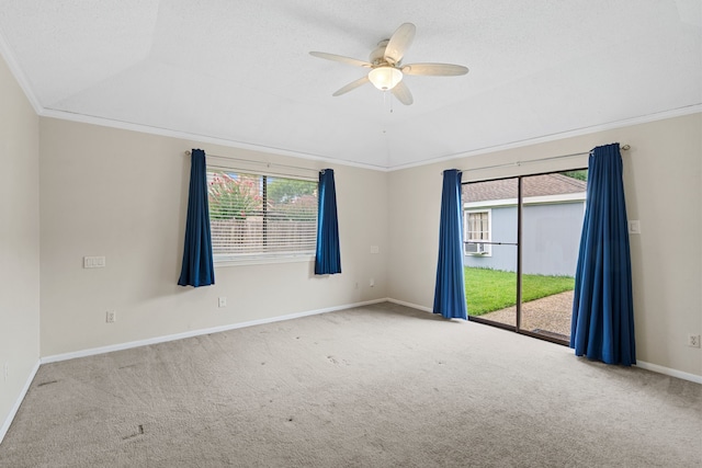 815 Millpond Dr, Sugar Land, TX 77498 - carpeted empty room with healthy amount of natural light, ceiling fan, a tray ceiling, and crown molding