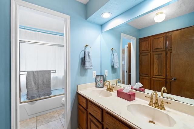 815 Millpond Dr, Sugar Land, TX 77498 - full bathroom with double vanity, combined bath / shower with glass door, and tile patterned flooring