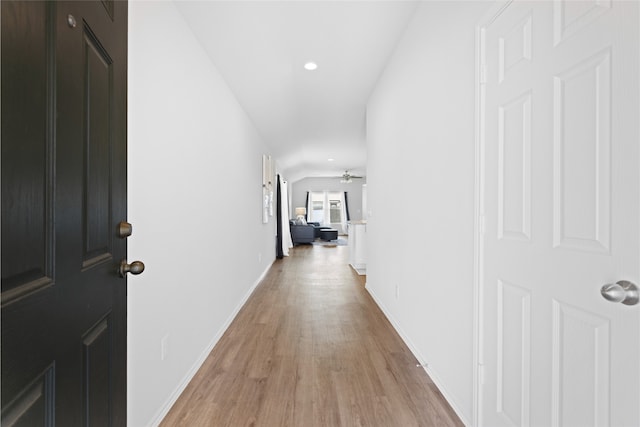 10530 Vinca Minor Ln, Houston, TX 77016 - corridor with light wood-style flooring, baseboards, and recessed lighting