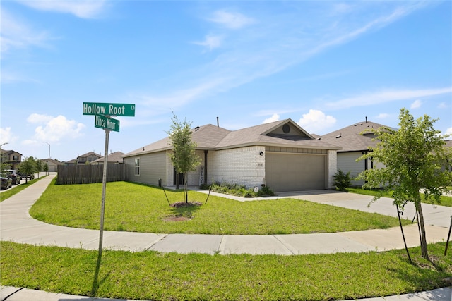10530 Vinca Minor Ln, Houston, TX 77016 - view of front of property with concrete driveway, a garage, and brick siding