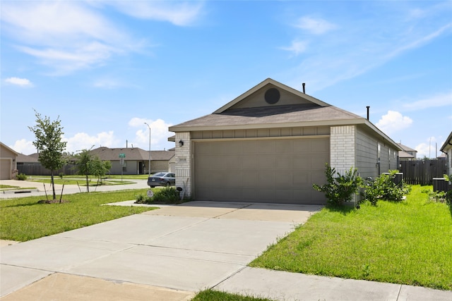 10530 Vinca Minor Ln, Houston, TX 77016 - view of front of property with brick siding, driveway, and central AC unit
