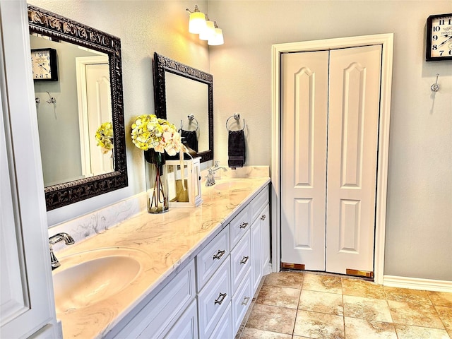 3898 County Road 135th Rd, Wharton, TX 77488 - bathroom featuring double vanity and baseboards