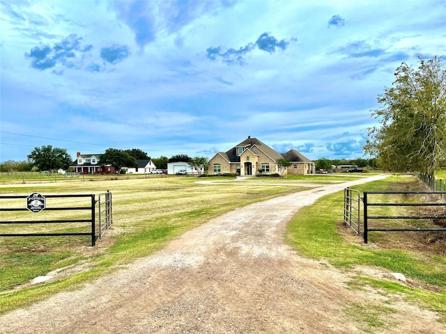 3898 County Road 135th Rd, Wharton, TX 77488 - view of dirt / gravel driveway featuring a gated entry