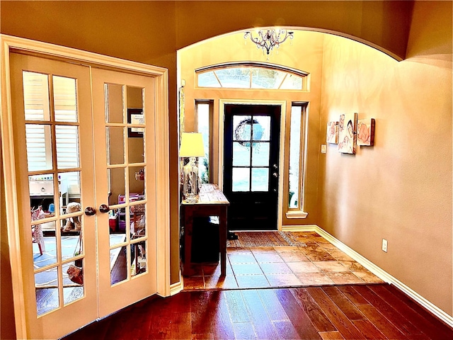 3898 County Road 135th Rd, Wharton, TX 77488 - foyer entrance featuring french doors, baseboards, and dark wood-style flooring