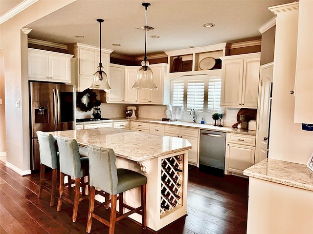 3898 County Road 135th Rd, Wharton, TX 77488 - kitchen with stainless steel appliances, crown molding, a kitchen island, dark wood finished floors, and recessed lighting