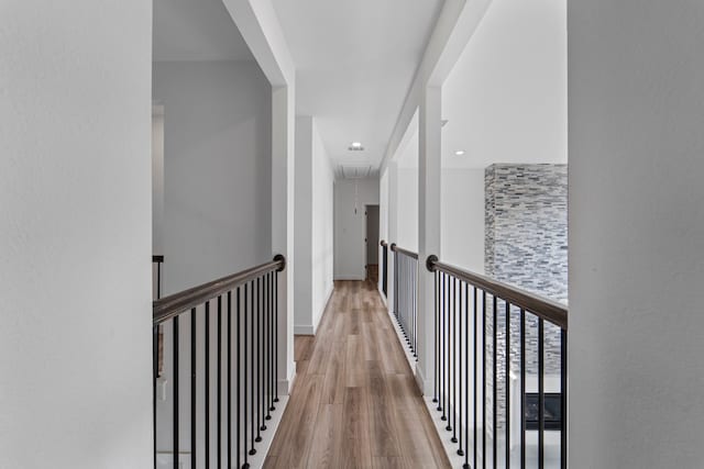 9818 Daffodil Springs Dr, Richmond, TX 77407 - hall featuring attic access, wood finished floors, an upstairs landing, and recessed lighting