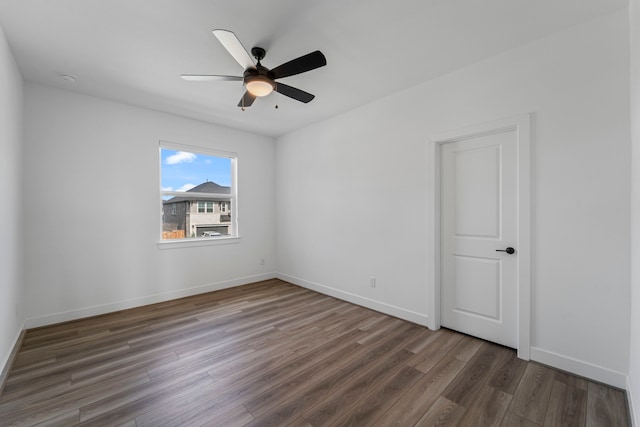 9818 Daffodil Springs Dr, Richmond, TX 77407 - empty room featuring wood finished floors, a ceiling fan, and baseboards