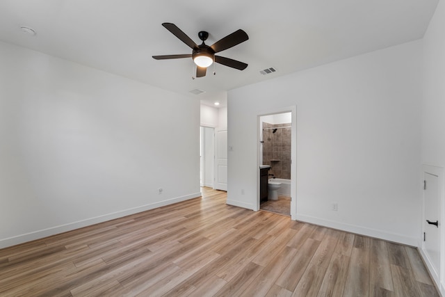 9818 Daffodil Springs Dr, Richmond, TX 77407 - unfurnished bedroom with light wood-type flooring, baseboards, ensuite bathroom, and a ceiling fan