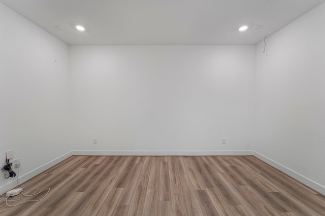 9818 Daffodil Springs Dr, Richmond, TX 77407 - spare room with wood finished floors, baseboards, and recessed lighting