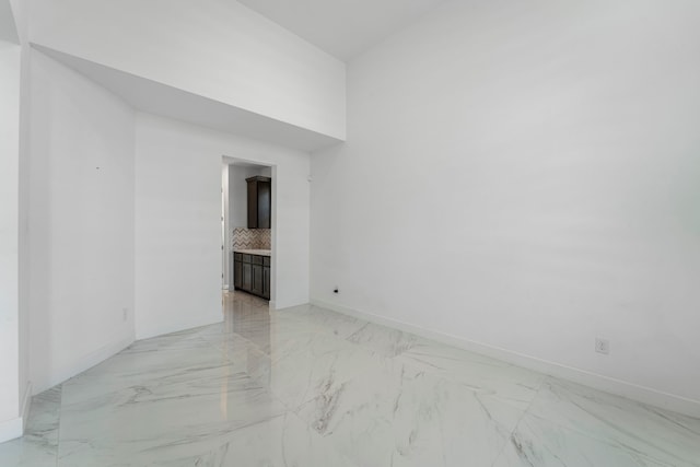 9818 Daffodil Springs Dr, Richmond, TX 77407 - empty room featuring light marble finish floors and baseboards