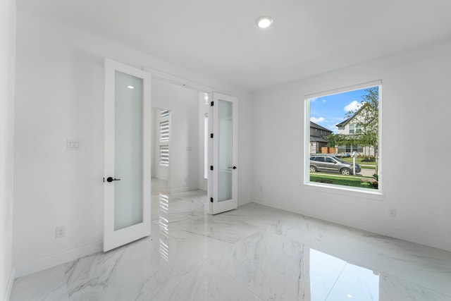 9818 Daffodil Springs Dr, Richmond, TX 77407 - spare room featuring baseboards, marble finish flooring, and recessed lighting