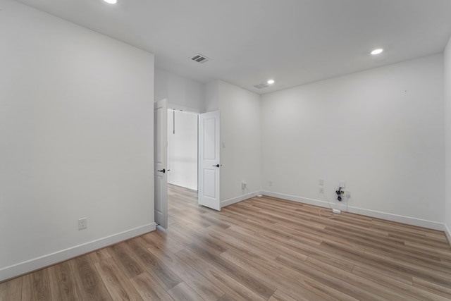 9818 Daffodil Springs Dr, Richmond, TX 77407 - spare room with light wood-style flooring, recessed lighting, and baseboards