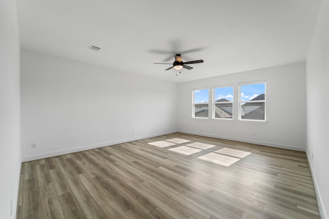 9818 Daffodil Springs Dr, Richmond, TX 77407 - unfurnished room featuring ceiling fan, wood finished floors, and baseboards