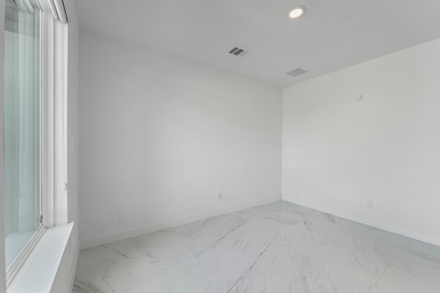 9818 Daffodil Springs Dr, Richmond, TX 77407 - unfurnished room featuring light marble finish flooring, baseboards, and recessed lighting