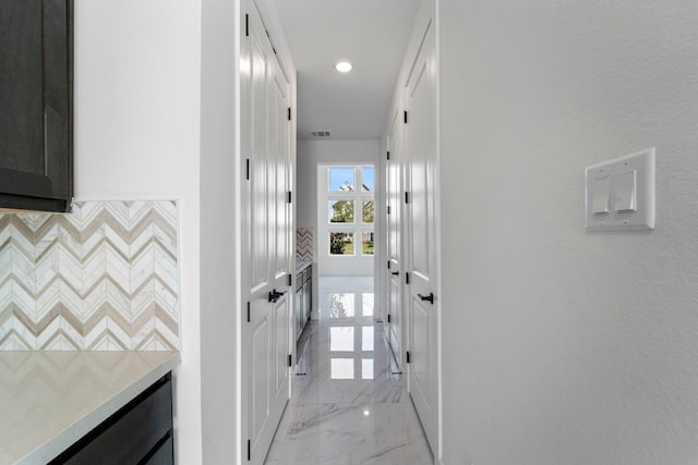 9818 Daffodil Springs Dr, Richmond, TX 77407 - corridor with light marble finish flooring, recessed lighting, and baseboards