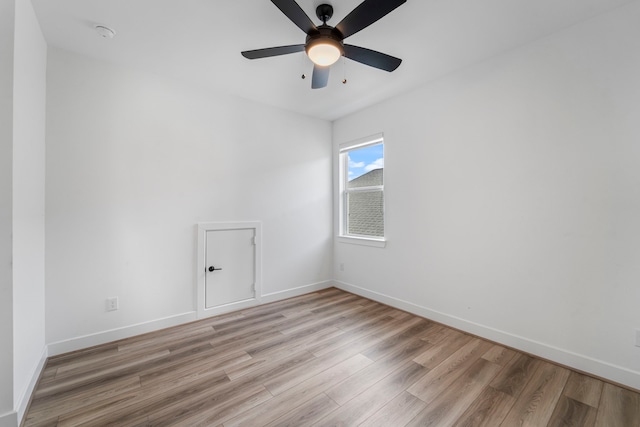 9818 Daffodil Springs Dr, Richmond, TX 77407 - empty room featuring light wood-style floors, ceiling fan, and baseboards