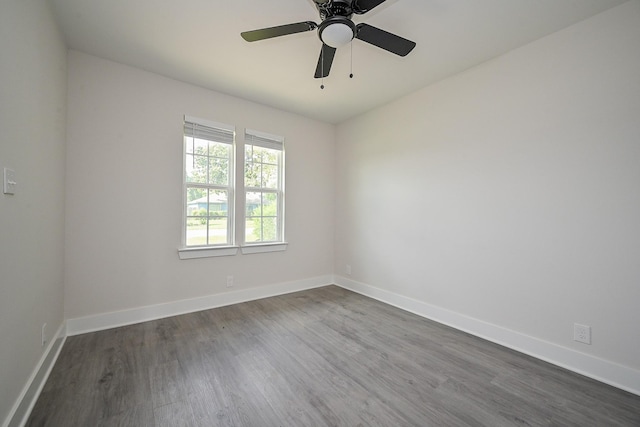 226 Hyta St, Houston, TX 77018 - empty room featuring dark wood finished floors, baseboards, and a ceiling fan