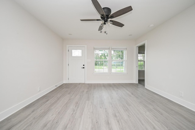 226 Hyta St, Houston, TX 77018 - unfurnished living room with light wood-style flooring, a ceiling fan, and baseboards