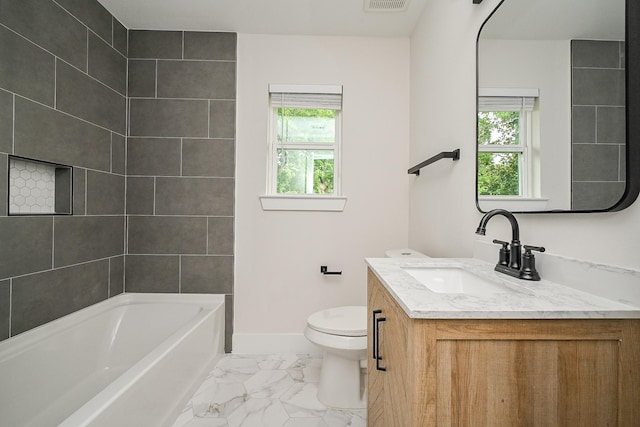 226 Hyta St, Houston, TX 77018 - bathroom with vanity, marble look tile flooring, toilet, baseboards, and shower / tub combination
