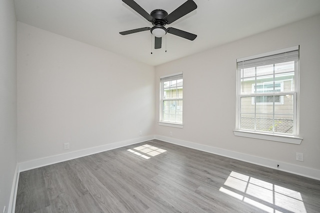 226 Hyta St, Houston, TX 77018 - empty room with wood finished floors, baseboards, and ceiling fan