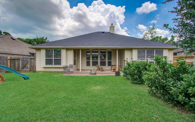 18611 Camellia Estates Ln, Cypress, TX 77429 - back of house with a chimney and a patio area