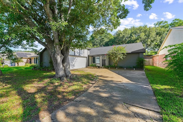 16026 Beechnut St, Houston, TX 77083 - mid-century inspired home featuring concrete driveway and a garage