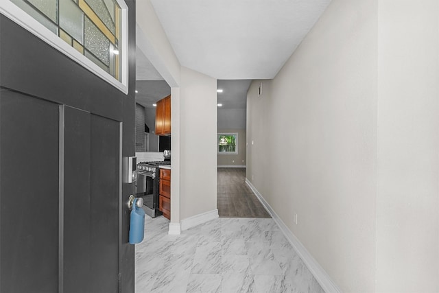 16026 Beechnut St, Houston, TX 77083 - hallway featuring light marble finish floors and baseboards