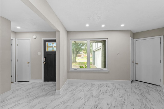16026 Beechnut St, Houston, TX 77083 - foyer entrance featuring light marble finish flooring and recessed lighting