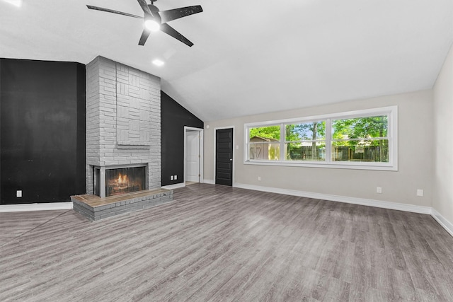 16026 Beechnut St, Houston, TX 77083 - unfurnished living room featuring ceiling fan, wood finished floors, a fireplace, and lofted ceiling