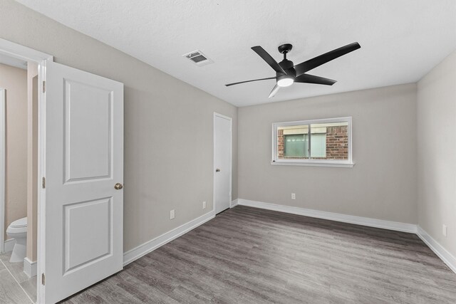 16026 Beechnut St, Houston, TX 77083 - unfurnished bedroom with wood finished floors and a ceiling fan