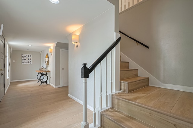 13622 Indian Creek Rd, Houston, TX 77079 - stairs featuring wood finished floors, baseboards, and recessed lighting