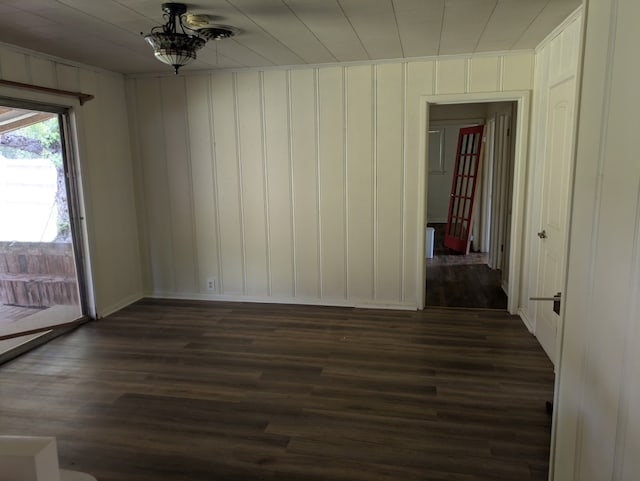 405 Gifford, Rusk, TX 75785 - spare room featuring dark wood-style flooring and baseboards