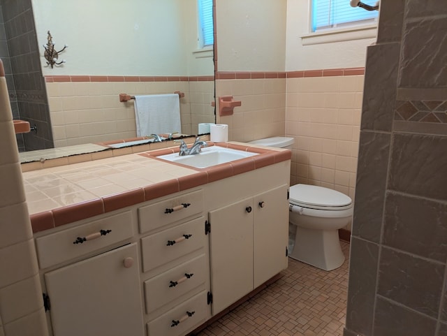 405 Gifford, Rusk, TX 75785 - bathroom with tile walls, toilet, vanity, and wainscoting