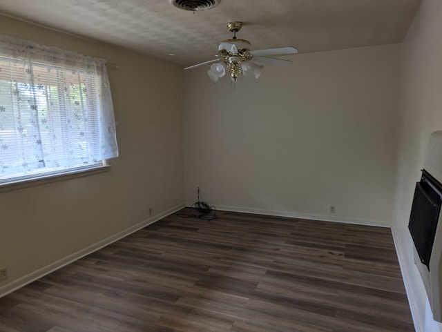 405 Gifford, Rusk, TX 75785 - unfurnished living room with ceiling fan, wood finished floors, and baseboards