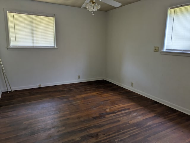 405 Gifford, Rusk, TX 75785 - empty room with dark wood-style flooring, ceiling fan, and baseboards